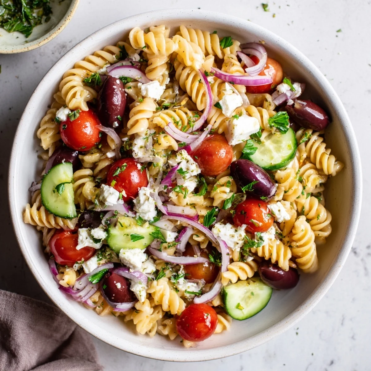 Mediterranean Olive Oil and Feta Pasta Salad, a colorful vegetarian delight, perfect for a summer lunch.