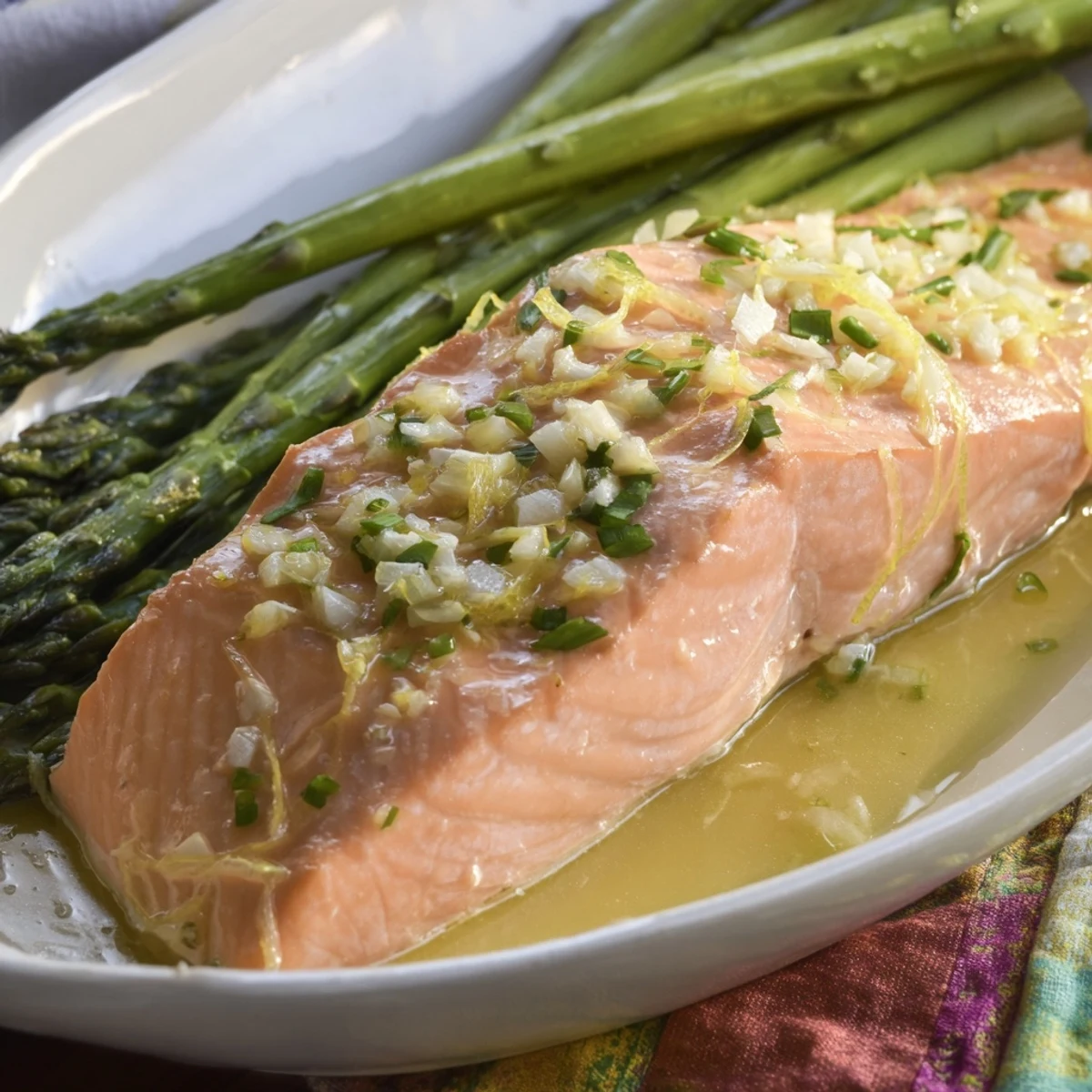 A complete American dinner: Pan-seared skillet lemon-butter salmon with bright green asparagus.