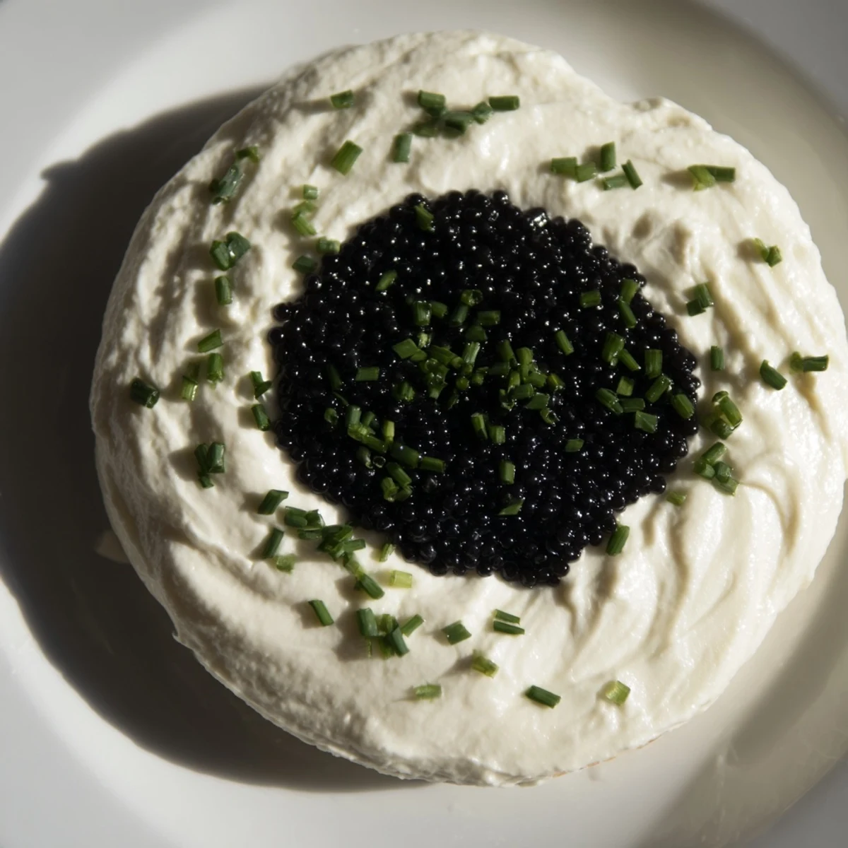 Elegant Diamond Inlay appetizer: a ring of cream cheese surrounds a glistening caviar diamond.