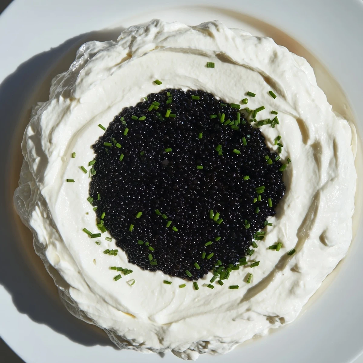 A close-up view of the Diamond Inlay appetizer, featuring a vibrant center of olive tapenade on crackers.