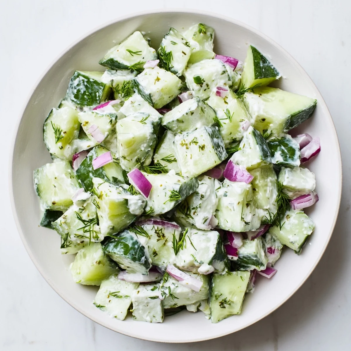 Creamy Cucumber and Greek Yogurt Tzatziki Salad, with fresh dill, is a refreshing summer side.
