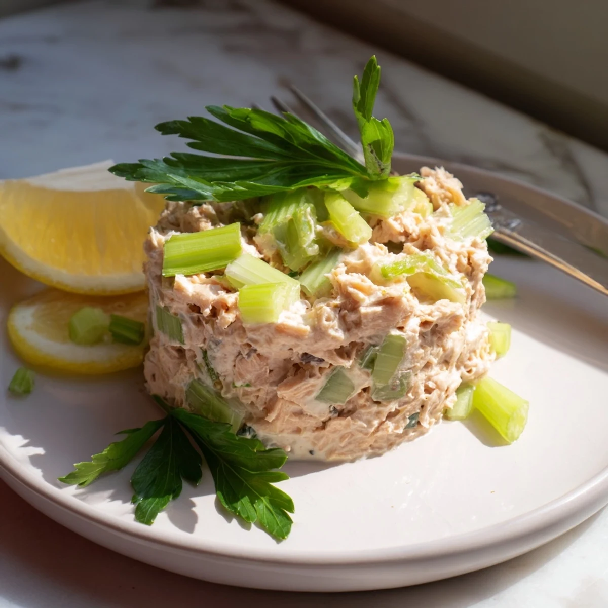 A vibrant Spicy Zesty Tuna Salad on toasted artisan bread, showcasing flaky tuna mixed with red spicy mayo and fresh herbs.