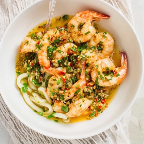 Vibrant Light & Bright Lemon Herb Shrimp Scampi with a luscious lemon sauce, ready for a delicious meal.