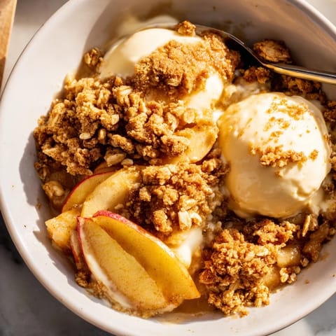 This warm Apple and Cinnamon Crumble offers a delightful blend of tender apples and a sweet, crunchy topping.