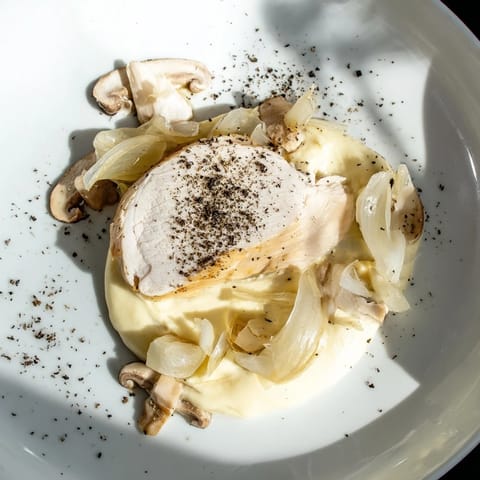 Imagine the elegance: this Ghostly Gala dish contains poached chicken, smooth purée, and mushrooms.