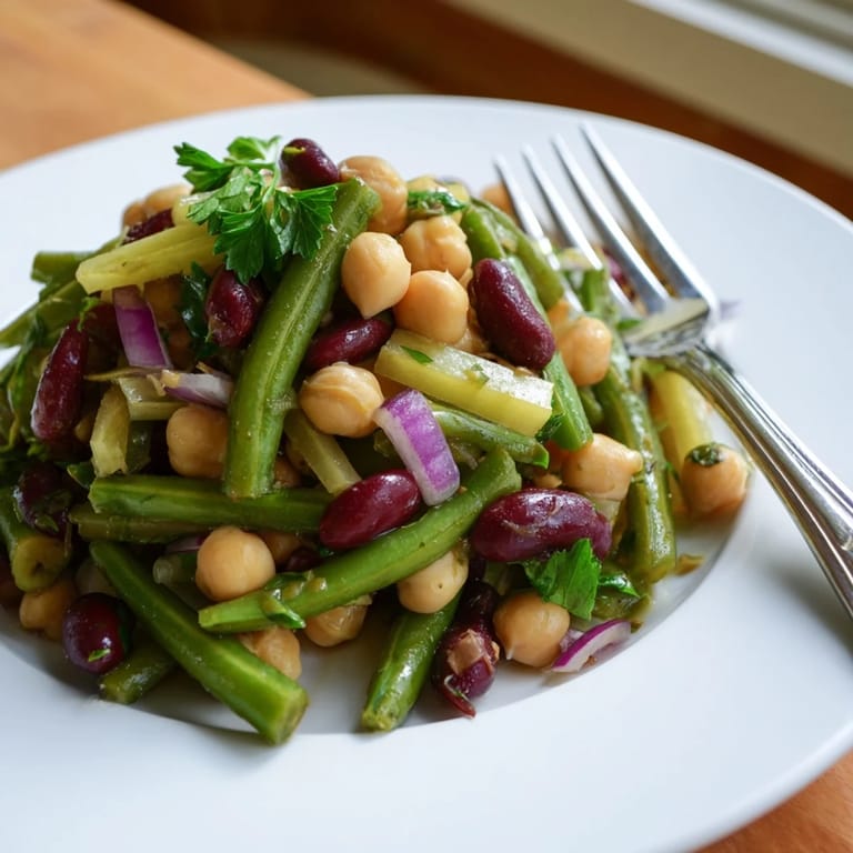 A colorful, easy Three-Bean Salad with beans and crisp veggies, ideal for potlucks or a healthy gluten-free lunch side.