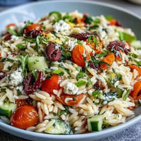 Refreshing Summer Orzo Salad with Feta, bursting with lemon and fresh veggies.